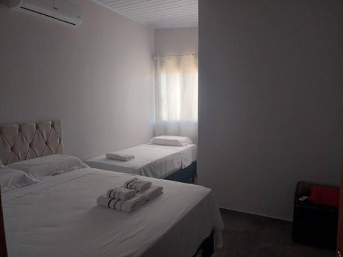 Katil atau katil-katil dalam bilik di Apt novo202 centro ametista do sul