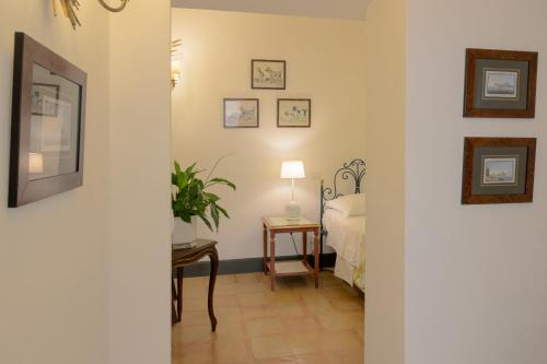 Postel nebo postele na pokoji v ubytování Palazzo Belmonte