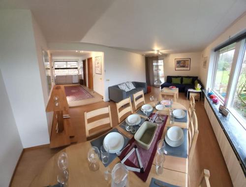 an overhead view of a living room with a table and chairs at Family Friendly Apt B, 900m to Lego House, parking, Legoland, Lalandia in Billund