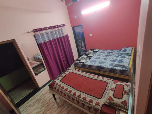 Ένα ή περισσότερα κρεβάτια σε δωμάτιο στο Trinity Villa - Home Stay