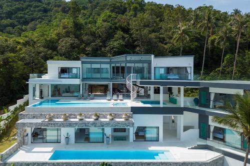 an aerial view of a house with a swimming pool at Villa Murano Samui in Amphoe Koh Samui