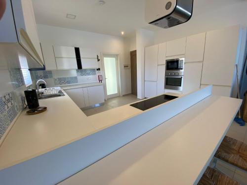 Η κουζίνα ή μικρή κουζίνα στο DUPLEX PENTHOUSE