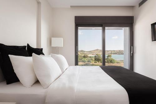 Säng eller sängar i ett rum på Cape Sea View Residence at Sounio