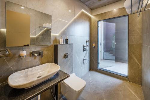 a bathroom with a sink and a shower at SaffronStays Blueberry in Panchgani