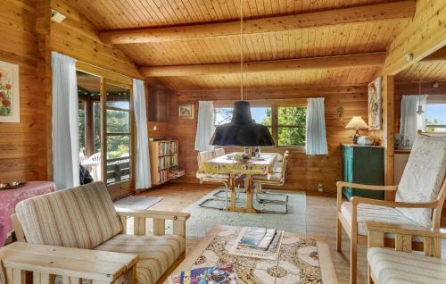 a living room with a couch and a table at 3 Bedroom Nice Home In Samsø in Tanderup