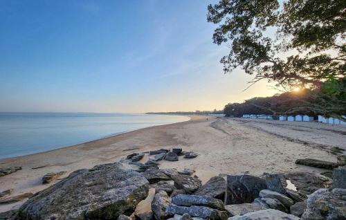 a view of a beach with rocks and the ocean at Nice Apartment In Noirmoutier-En-L'île in Noirmoutier-en-l'lle