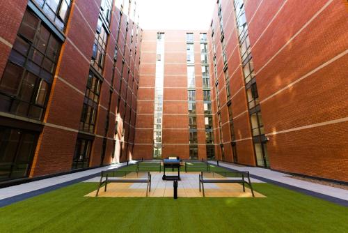 a hallway with benches in the middle of a building at For Students Only at Great Patrick Street in Belfast