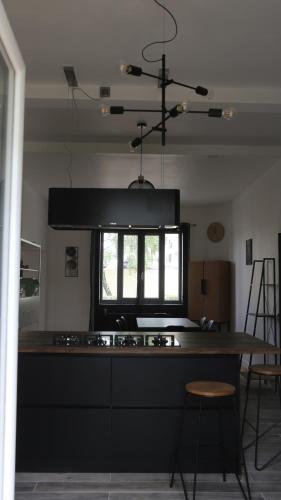 a kitchen with a stove and a window at Maison de 100 M2 équipée de 4 chambres. in Valence