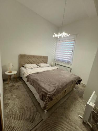 Ένα ή περισσότερα κρεβάτια σε δωμάτιο στο Apartment Magnolia