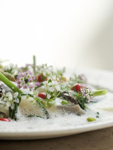 a plate of food with flowers on it at Botanic Sanctuary Antwerp - The Leading Hotels of the World in Antwerp