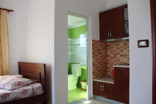 Un pat sau paturi într-o cameră la Vila Ester