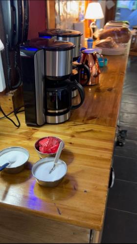 a counter with three measuring spoons on top of it at OTTO SKY & SUMMER in San Carlos de Bariloche