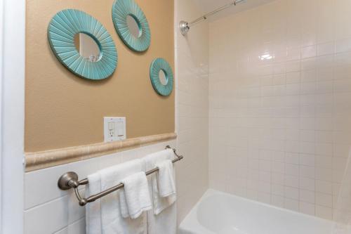 a bathroom with a mirror and white towels at STUNNING HOME 4 MIN WALK TO BEACH, RESERVED PRKG in Laguna Beach