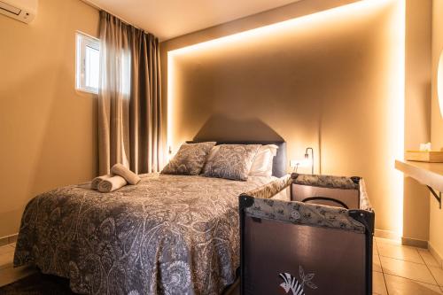 a bedroom with a bed and a window at Dantis Place in Nafplio wheel chair accessible in Nafplio