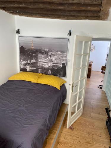 Postel nebo postele na pokoji v ubytování Chambre privée dans appartement au cœur de Paris
