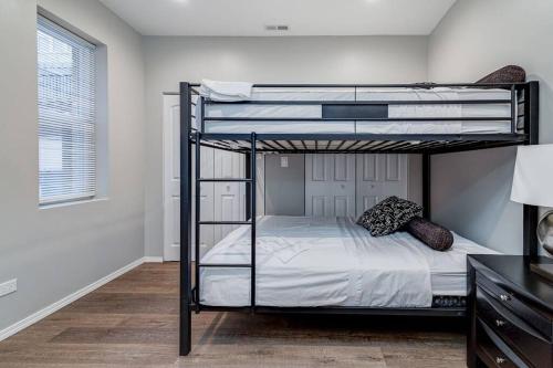 a bedroom with two bunk beds in a room at Suite 2 on Southport 4 Queen Beds in Chicago