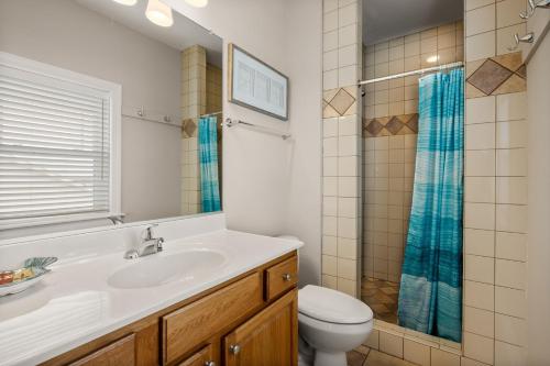 a bathroom with a sink and a toilet and a shower at SP301S - Endless Summer in Kill Devil Hills