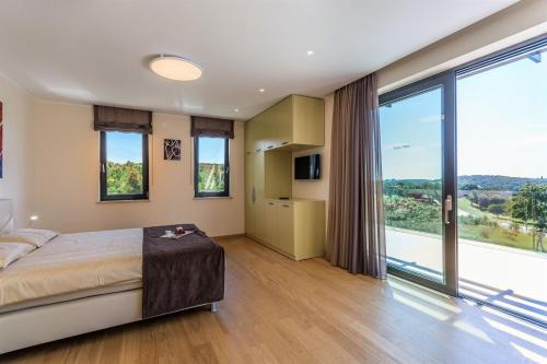 Giường trong phòng chung tại Villa Maja