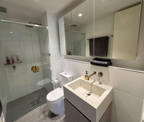 a bathroom with a sink and a toilet and a shower at The Forest in the heart of CBD in Adelaide
