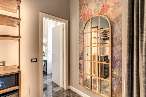 a room with a large mirror and a door at Apollo Boutique Hotel in Rome