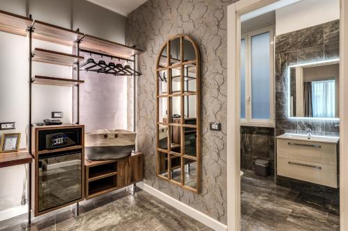 a bathroom with a sink and a mirror at Apollo Boutique Hotel in Rome