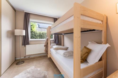a bunk bed room with two bunk beds at Villa T’Uzetje – villa with pool in Oostduinkerke in Oostduinkerke