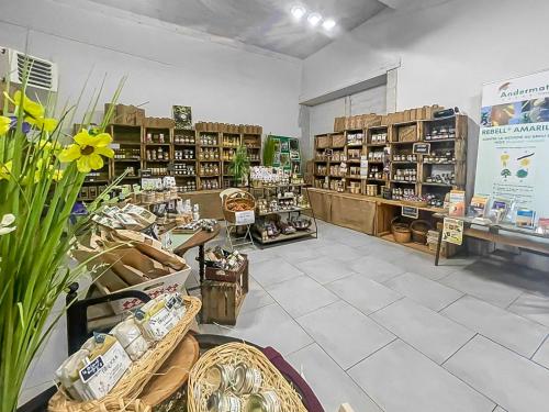 a store aisle with shelves of products in a store at Le Cocon d'Availles en Chatellerault in Availles en Chatellerault
