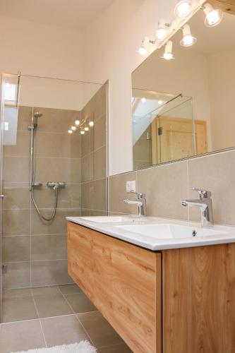 a bathroom with a sink and a shower at Apartment Vordermitterast in Kirchberg in Tirol