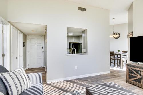 a living room with a couch and a tv at Columbia Vacation Rental - Walk to UofSC Campus! in Columbia