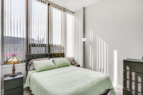 a bedroom with a bed and a large window at Columbia Vacation Rental - Walk to UofSC Campus! in Columbia