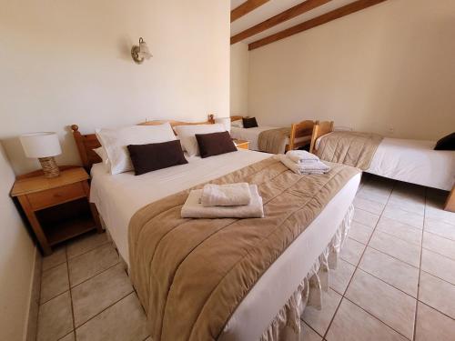 Ένα ή περισσότερα κρεβάτια σε δωμάτιο στο Lodge Don Julio