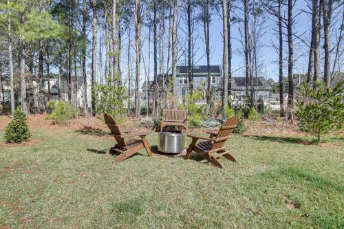 two chairs and a picnic table with a grill in a yard at Ocean View Home with Kayaks about 2 Mi to Bethany Beach in Ocean View