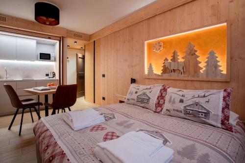 Ένα ή περισσότερα κρεβάτια σε δωμάτιο στο Chalet al Tabià