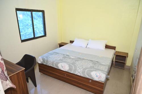 Postelja oz. postelje v sobi nastanitve Hotel Mahamaya Guest House Varanasi