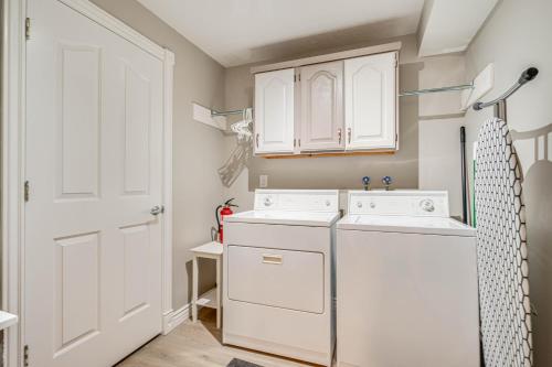 a white laundry room with a washer and dryer at Lovely Remodeled North Salt Lake Apt 7 Mi to Dtwn in North Salt Lake