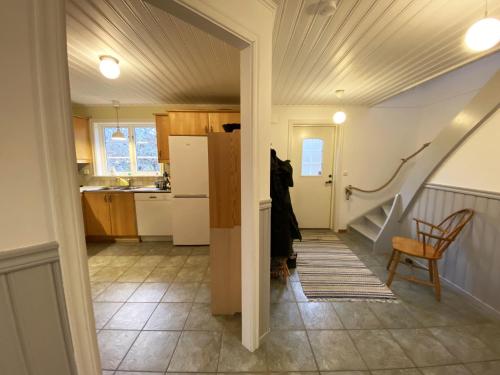 a kitchen with a stairway leading into a house at Holiday home by the sea with fantastic views in Ronneby