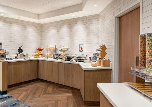 a large kitchen with a counter with food on it at Fairfield Inn Scranton in Scranton