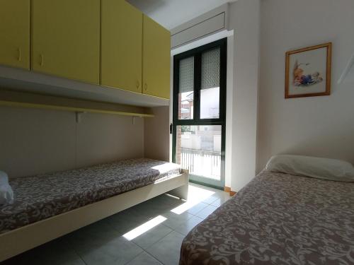 En eller flere senge i et værelse på Nelly house - con piscina e posto auto al coperto