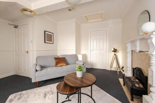 a living room with a couch and a table at Central Washington Apartment in Washington