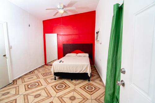 Ένα ή περισσότερα κρεβάτια σε δωμάτιο στο Hotel&Hostal Trinidad