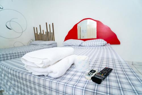 Een bed of bedden in een kamer bij hotel trinidad