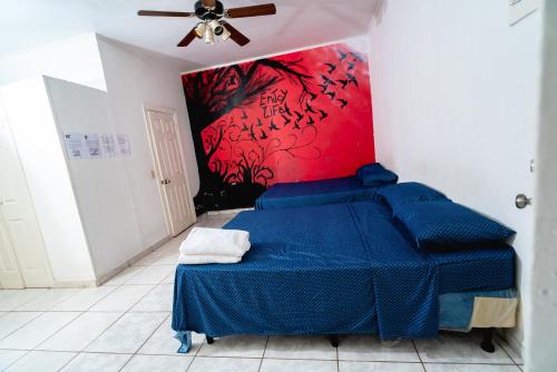 Ένα ή περισσότερα κρεβάτια σε δωμάτιο στο Hotel&Hostal Trinidad