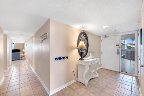 a hallway with a vanity and a mirror on the wall at Phoenix 6 Unit 215 in Orange Beach