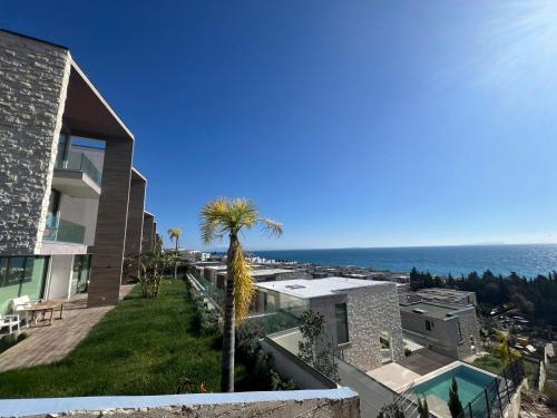 a house with a view of the ocean at MUMBAS APARTMENT DHERMI in Gjilek