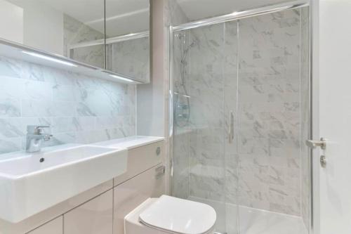 a bathroom with a shower and a toilet and a sink at Luxury 2B2B in central London in London