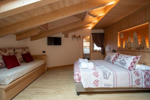 Ένα ή περισσότερα κρεβάτια σε δωμάτιο στο Chalet al Tabià