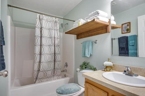 a bathroom with a sink and a toilet and a shower at Pet-Friendly Lakehouse View Tower and Fire Pit! in Lake Murray Shores