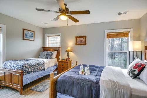 a bedroom with two beds and a ceiling fan at Pet-Friendly Lakehouse View Tower and Fire Pit! in Lake Murray Shores