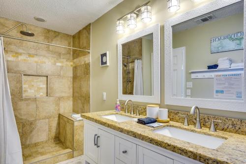 a bathroom with two sinks and a shower at Panama City Beach Home Steps to the Ocean! in Panama City Beach