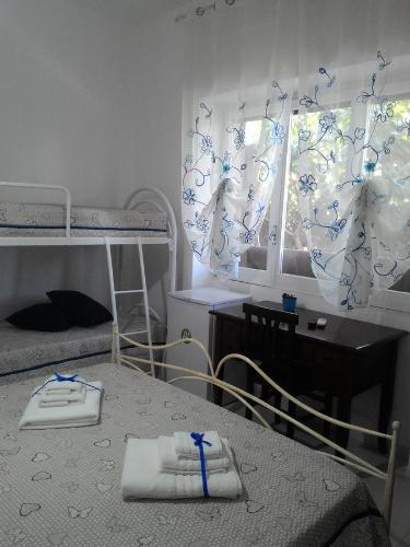 Ένα ή περισσότερα κρεβάτια σε δωμάτιο στο B&B L'Oasi dei Sogni